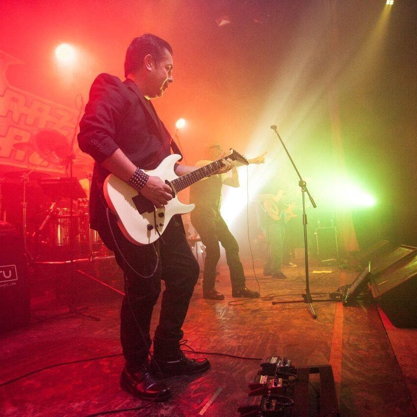 Antonio Benitez onstage with guitar.jpg