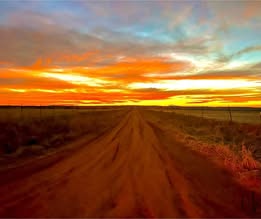May be an image of horizon, road, twilight and nature