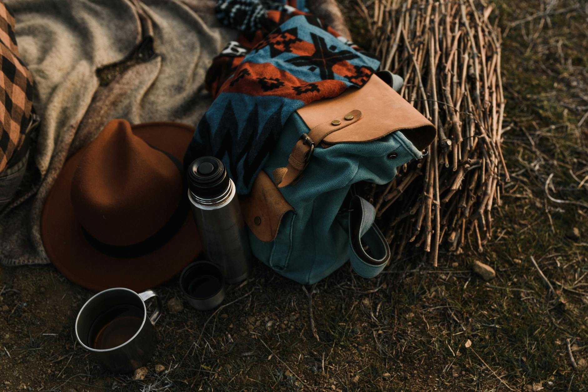 a close up shot of a vacuum flask beside a bag