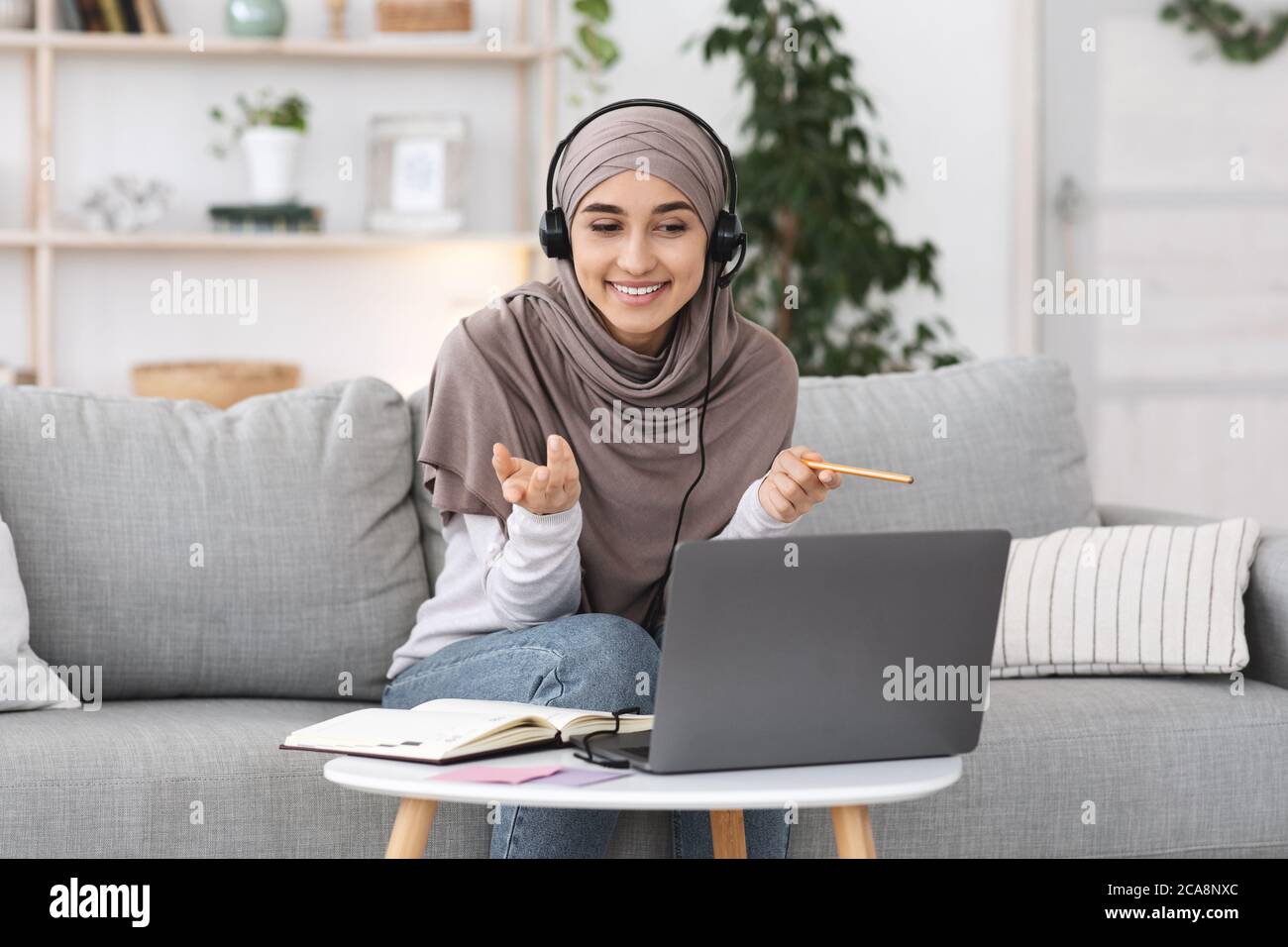 Online Tutoring. Young muslim woman teacher having video call with ...