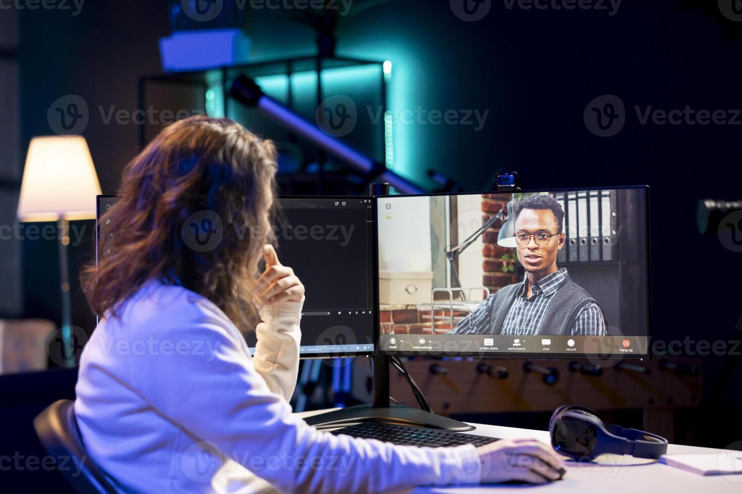 Computer science teacher doing online tutoring, telling student in ...