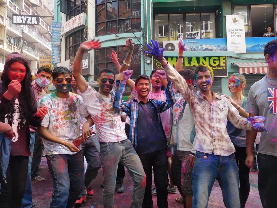 People joyfully colored powders during the Holi Festival celebration.