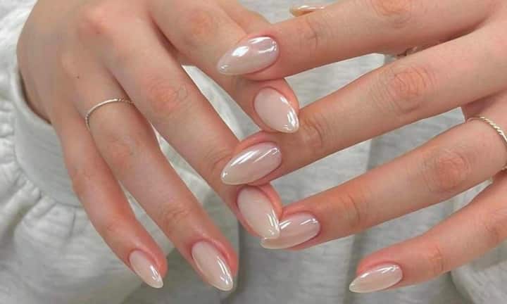 Chrome nails have replaced the classic red manicure at weddings these days. They're shiny and striking, and look like jewelry in their own right. Silver and rose gold chrome are the most popular this year. These nails look even more beautiful under the wedding lights. Therefore, you can opt for chrome nails for an engagement, cocktail night, or reception.