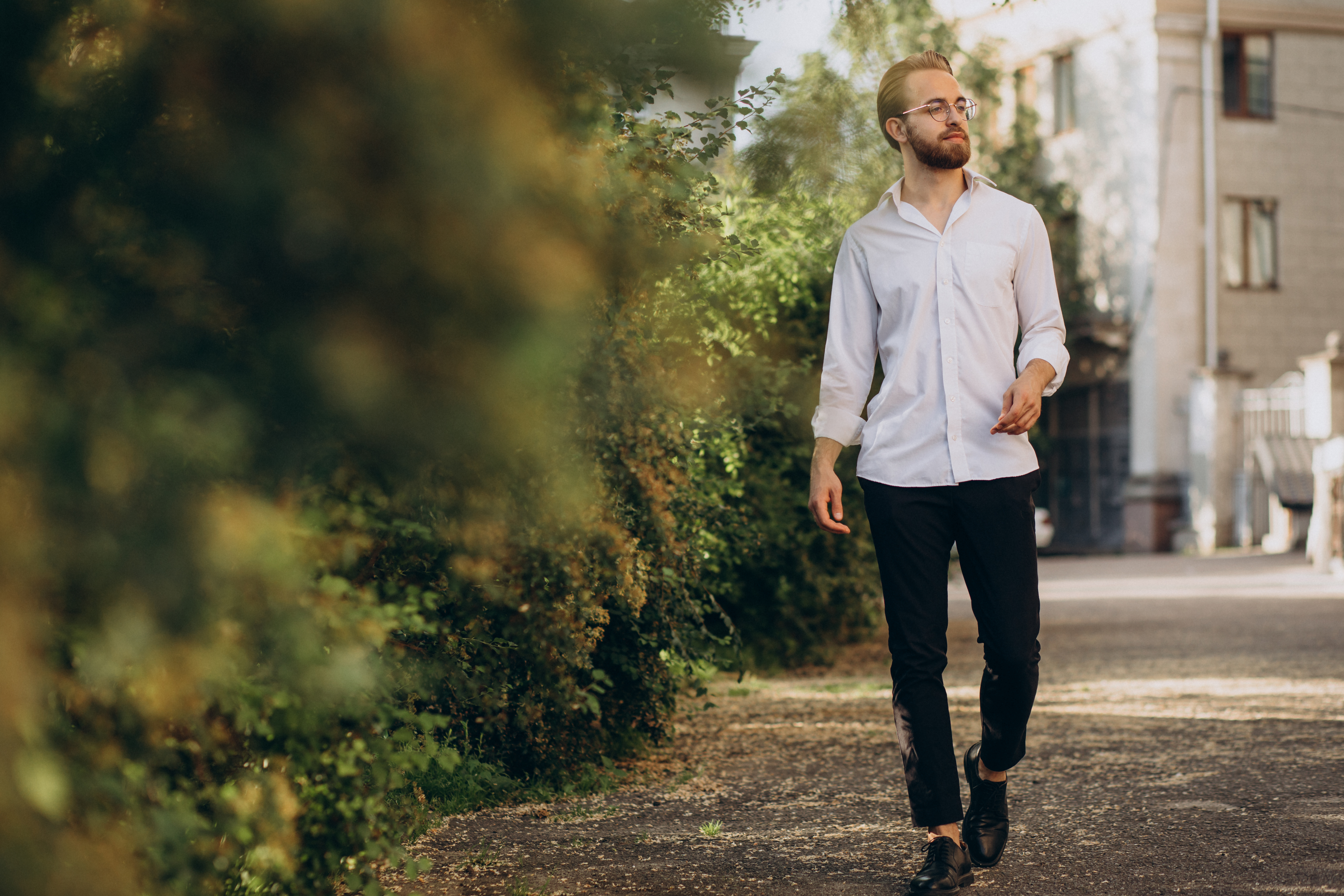 portrait-young-bearded-man-wearing-spectacles-walking-park.jpg