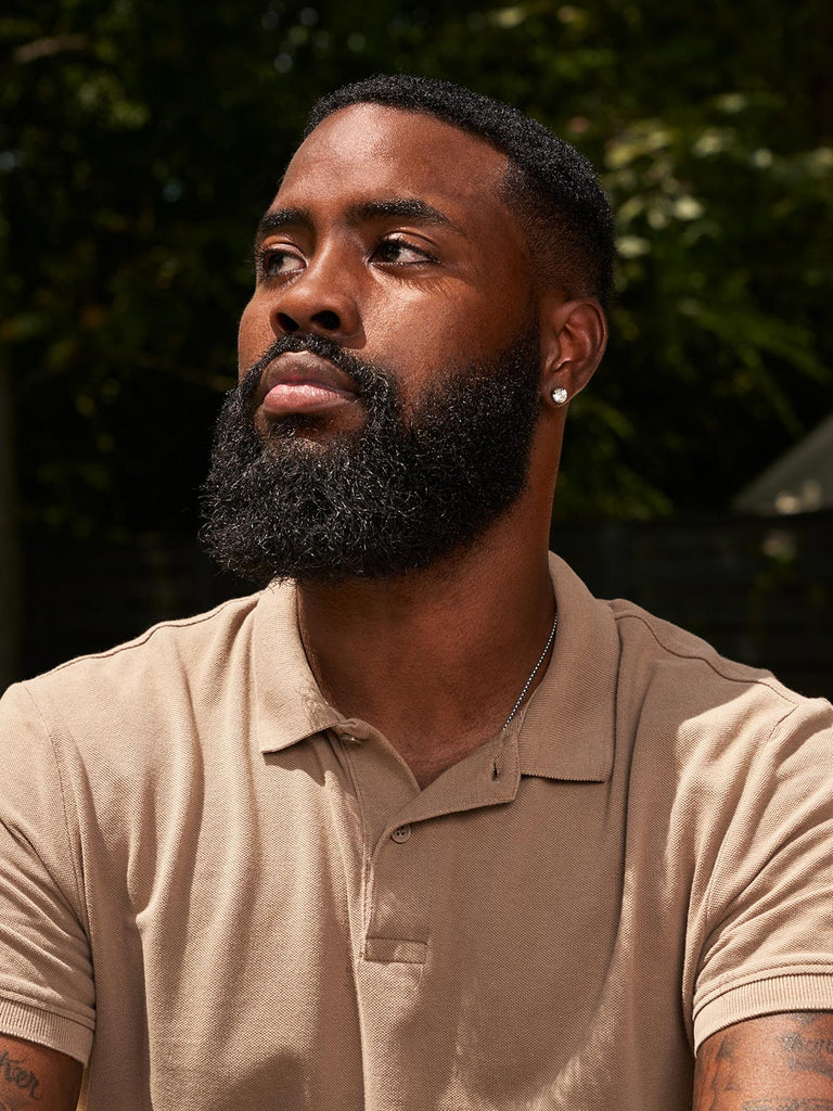 Black man with long power beard and trimmed mustache