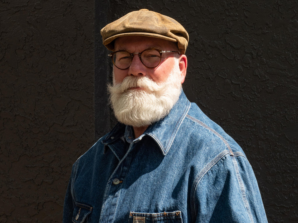 Man with a wavy white power beard and handlebar mustache