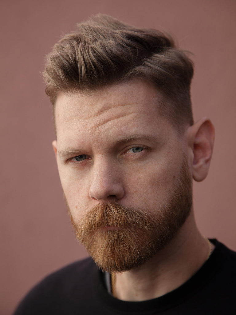 Eric Bandholz with a short corporate beard.