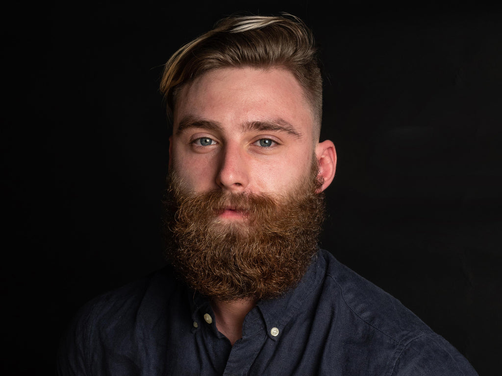 Blonde man with curly power beard and walrus mustache