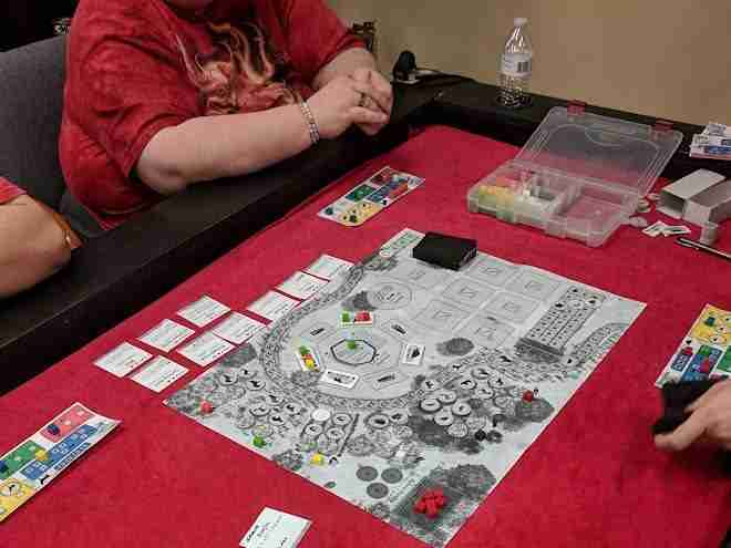 Playtesters around the table of an early prototype of Winter Rabbit.