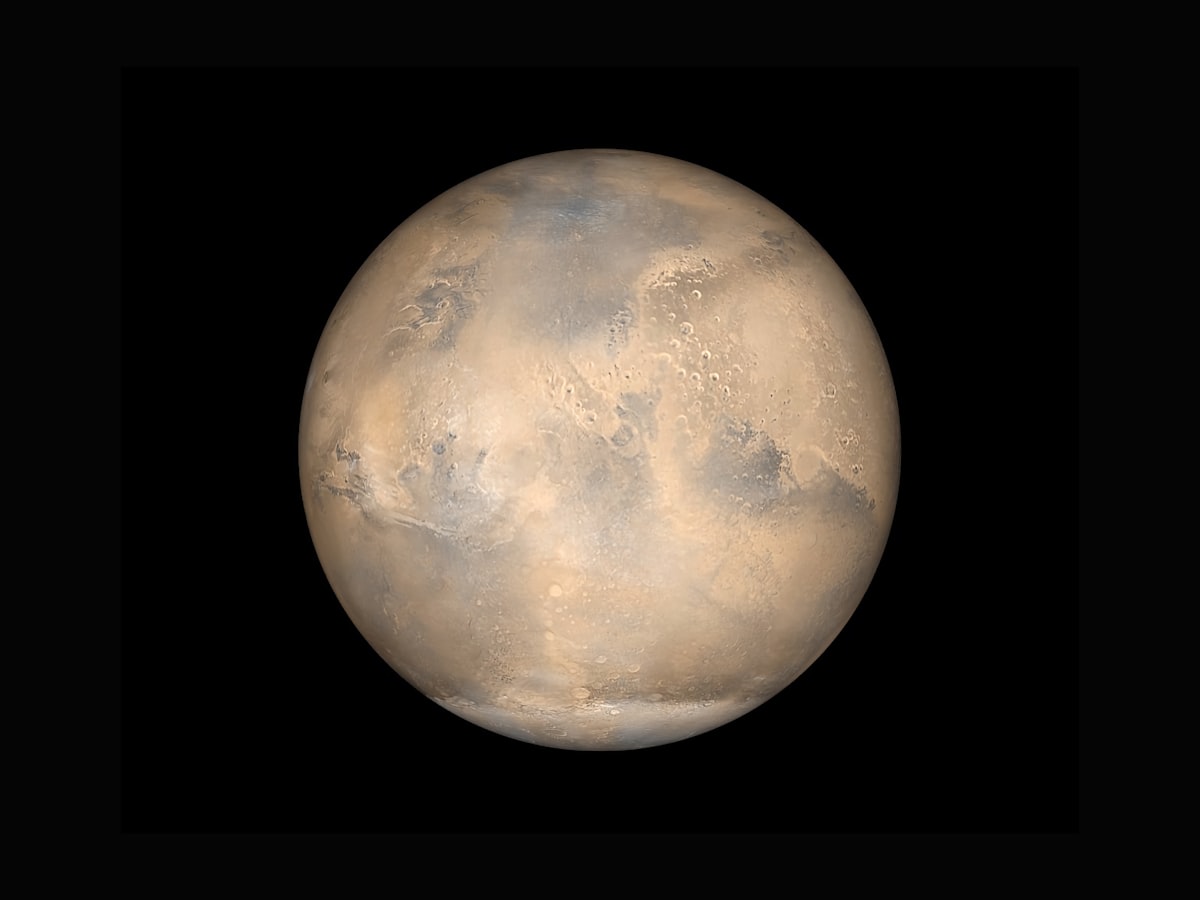 Mars visible as a red dot in the starry sky