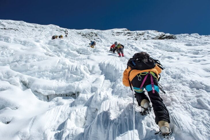 A moment frozen in time, it reflects the spirit of adventure amidst the towering peaks of the Everest region.