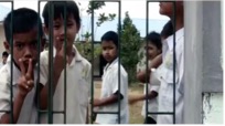 A group of children in white shirts Description automatically generated