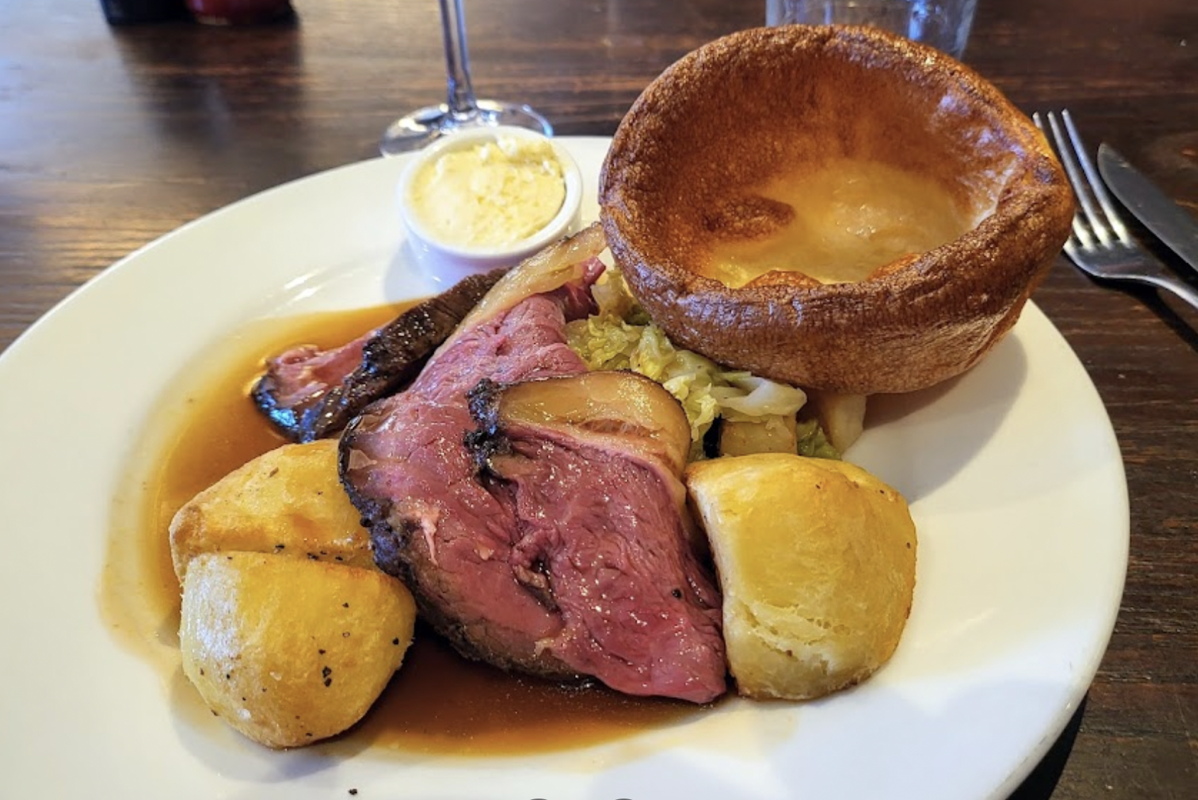 beef, potatoes, and a small dutch baby pancake