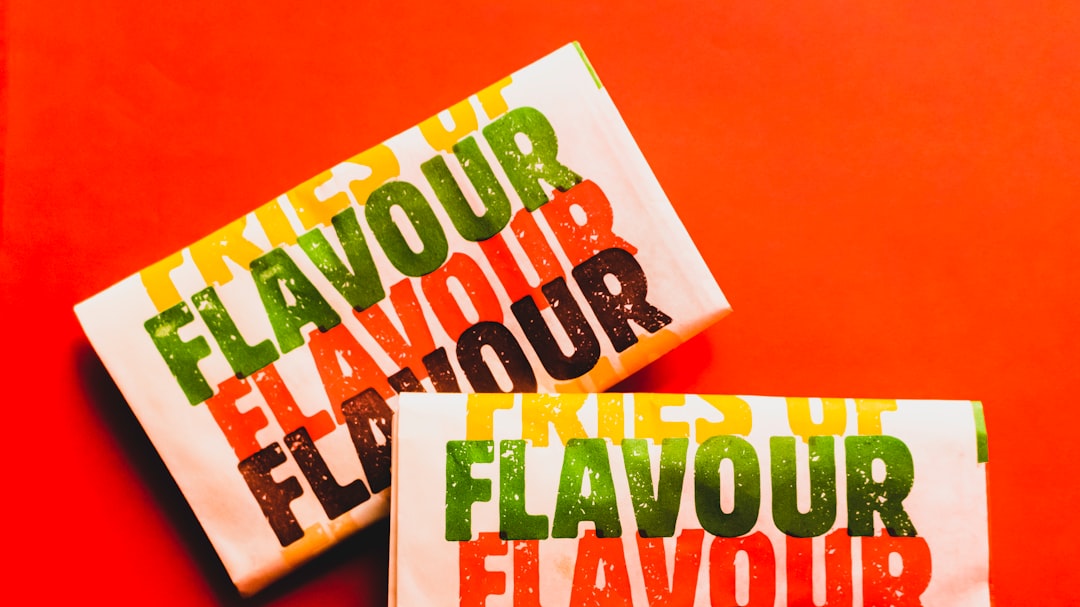 Brightly wrapped packages labeled “Flavour” on a bold red background, emphasizing bold, playful flavor appeal.