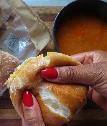 A person holding a sandwich

AI-generated content may be incorrect.