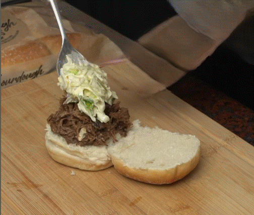 A fork being spread over a sandwich

AI-generated content may be incorrect.