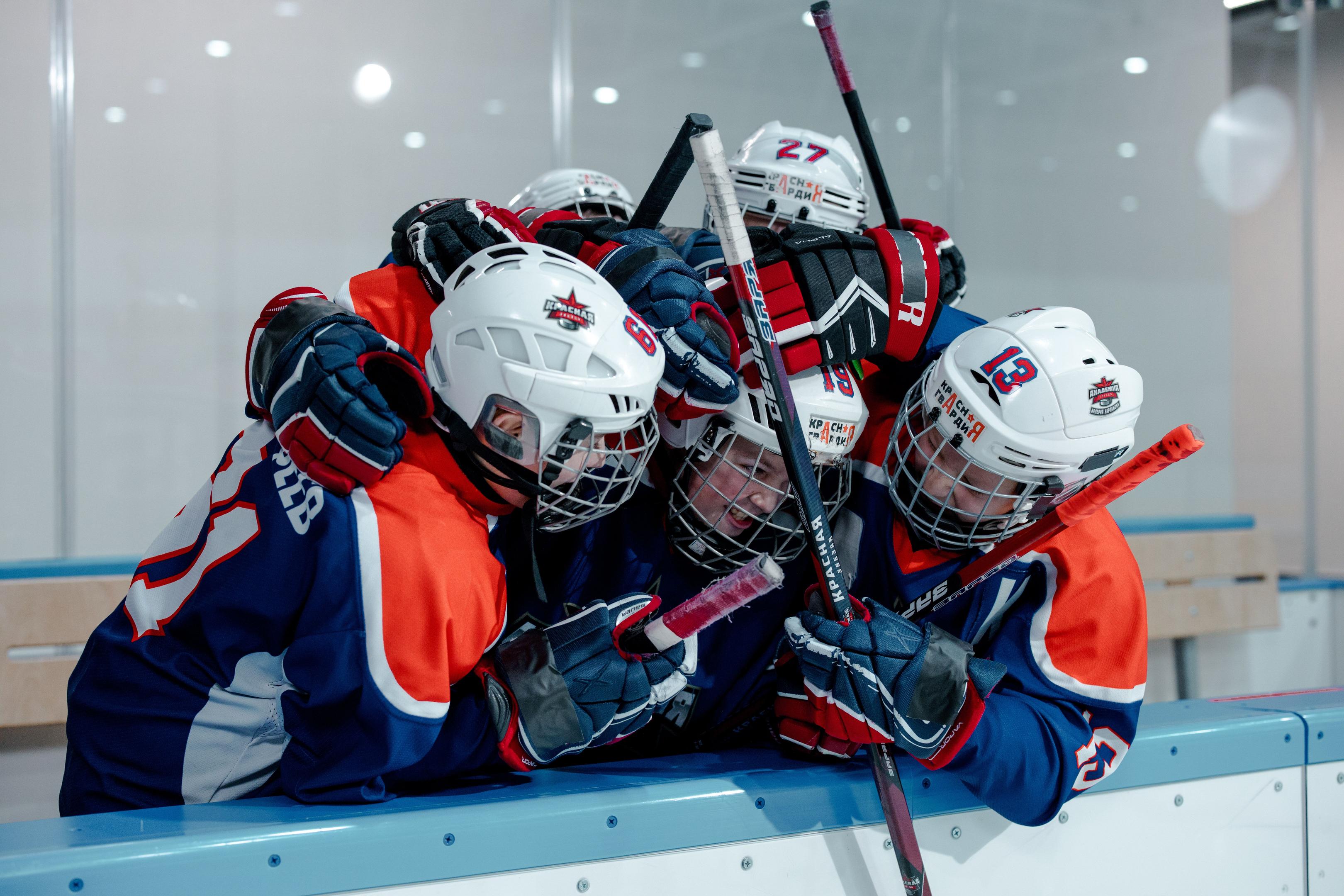 A hockey team celebrating together during a game