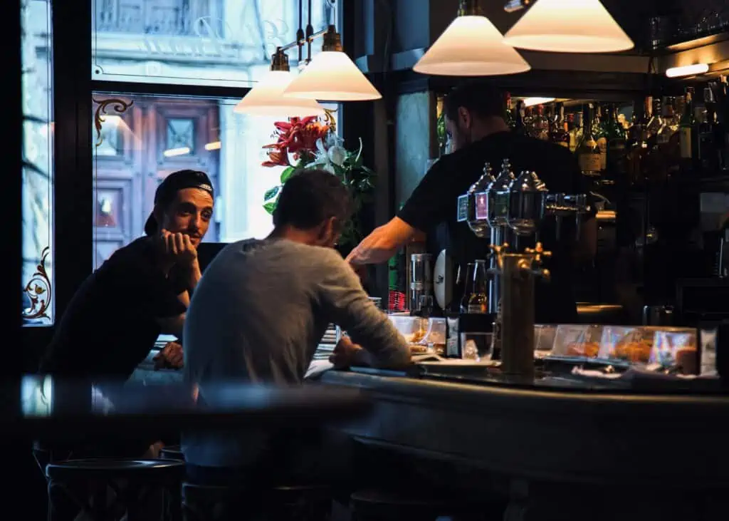 Two men in a bar. Friends. 