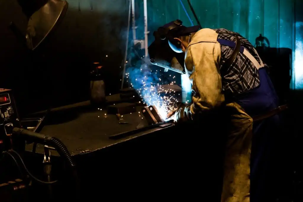 Welder working in a factory.