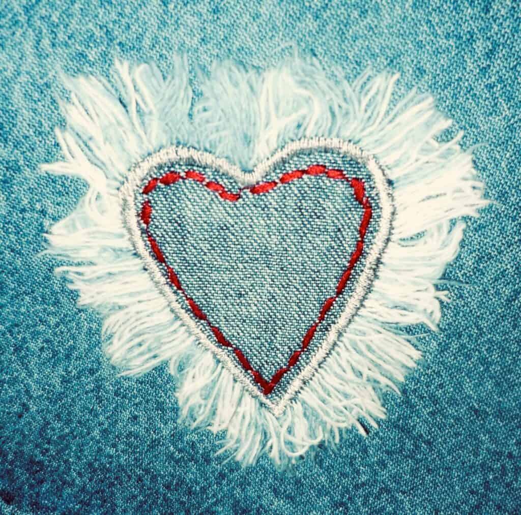 In a fashion vs style battle, style must always prevail. The picture shows a heart on denim jeans. 