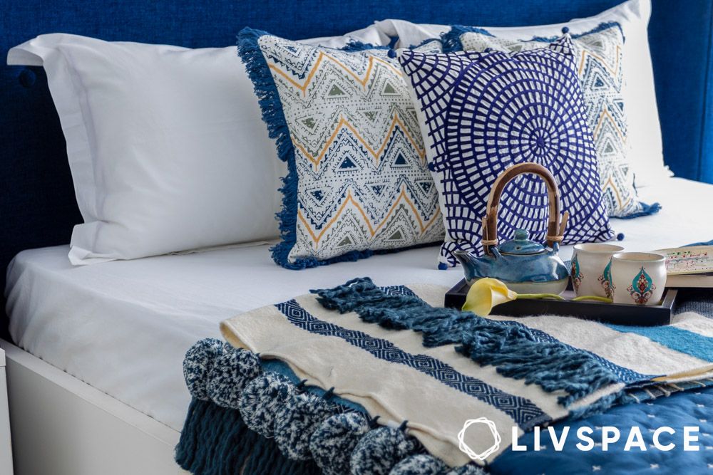 blue and white layered bed decor